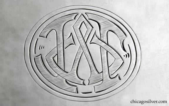 Kalo box, rectangular cedar-lined cigarette, hammered surface with overhanging lid on hinge.  Engraved stylized interlocking JWT monogram in oval on cover.  Deatil shown.