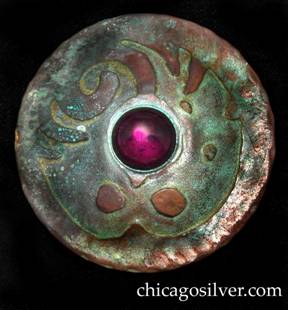 Forest Craft Guild brooch / pin, round, large, copper, with acid-etched design and hammered edges, centering a large protruding round bezel-set purple cabochon stone.  