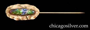 Forest Craft Guild stickpin, roughly oval, German silver, with freeform flat abstract almost random-looking chased decoration, centering an oval bezel-set iridescent blue-green glass stone