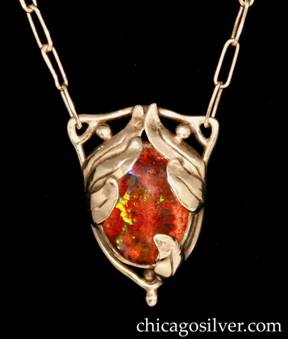 Forest Craft Guild pendant on chain, sterling silver, with boulder opal.  Triangular frame with large oval cabochon bezel-set boulder opal in iridescent red and green hues, with bead and wirework details in the upper corners and at the bottom, where the frame comes to a point.  Several upturned chased and cutout applied leaves on the sides to restrain the stone.  Paperclip chain with hook-and-eye fastener.  
