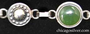Detail of Laurence Foss bracelet with cabochon chrysoprase stones on stepped small round silver frames