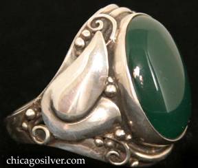 Laurence Foss ring, silver, large, with large oval bezel-set cabochon deep green onyx stone in prominent bezel frame surrounded by an applied stylized tulip flower and beads and wirework decoration on each side.  Heavy.  