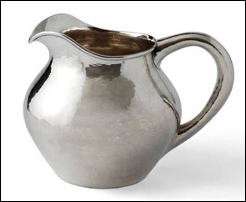 Kalo ovoid pitcher with arching spout and looping round section hollow handle