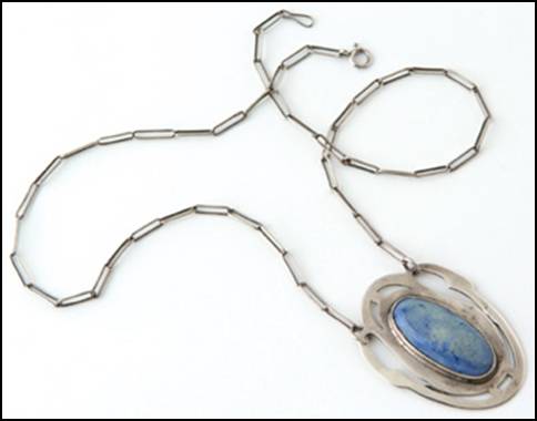 Art Silver Shop pendant on chain, handwrought in sterling silver with pierced geometric frame featuring a central dyed light blue mottled agate