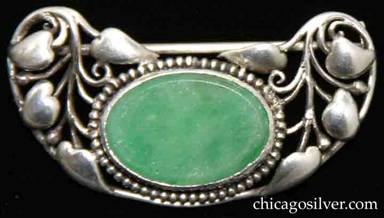 Frank Gardner Hale brooch, with floral pattern of vines and heart-shaped leaves on upturned kidney-shaped frame centering bezel-set oval green chalcedony stone ringed with a circle of very small silver beads
