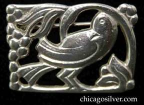Randahl brooch, small, rectangular, with cutout bird looking over its shoulder under curving tree with beads and flowers at the corners.  Heavy for its size.
