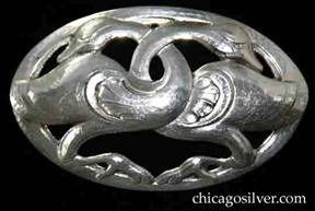 Randahl brooch, oval, with chased and cutout form of two geese or swans facing each other with intertwined necks, on oval frame.