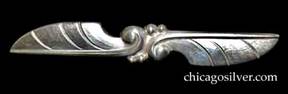 Randahl brooch, long and thin, shaped like two stylized feathers or leaves with scroll ends and silver beads in the center.  Heavy.
