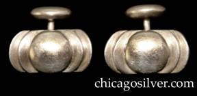 Kalo cufflinks, pair (2), rectangular, with curved ends, a pair of curved chased grooves at each end centering a flattened silver dome.  Fixed curved link at back with oval bead at the end.