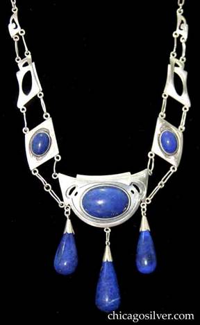 Kalo multipart necklace on paperclip chain, with cutouts, chased design, bezel-set lapis stones, and large teardrop-shaped lapis drops 