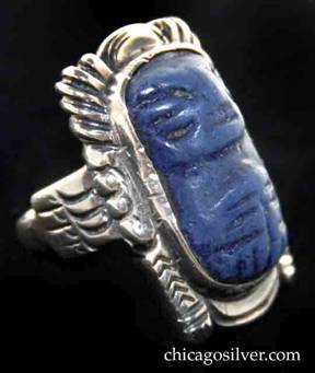 Kalo ring, Indian-motif, large and rectangular, with bezel-set dark blue carved stone inside heavy frame 