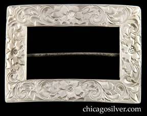 Lebolt brooch, buckle-form, flat wide slightly convex rectangular frame engraved with detailed floral design