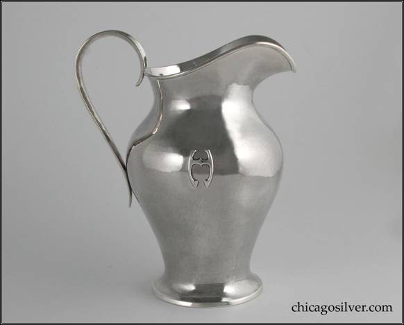 Kalo pitcher, vase form, with arching spout, curving strap handle whose ends extend slightly below where they join the main body on top and bottom, applied wire to rim, applied H monogram, and spreading self foot.  Similar to one pictured (#66) in Sharon Darling's "Chicago Metalsmiths" book.  7-9/16" H and 6-3/16" W.  STERLING / HAND WROUGHT / AT / THE KALO SHOP / 19 / 2 PINTS