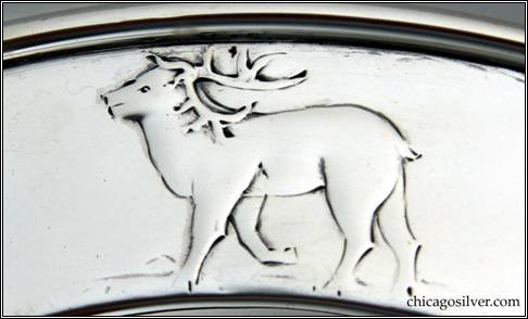 Kalo plate, child's, round, with raised border, chased and repouss design of reindeer, arctic fox, and polar bear -- detail