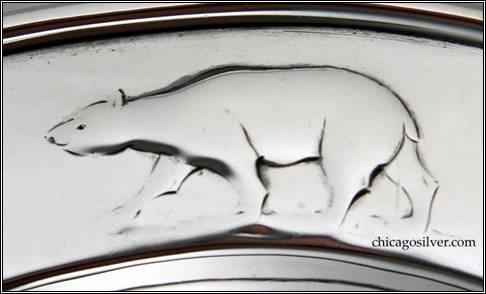 Kalo plate, child's, round, with raised border, chased and repouss design of reindeer, arctic fox, and polar bear -- detail