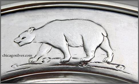 Kalo plate, child's, round, with three repouss animals (lion, cougar, polar bear) on flat raised edge with wire rim, engraved " Frank Jay Cobbs Jr. / September 28 -1913" on back -- detail