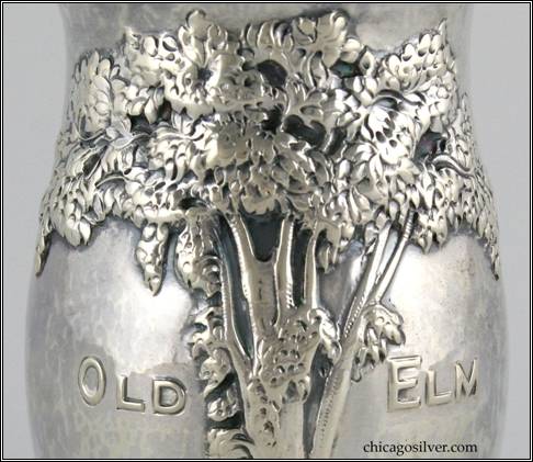 Kalo vase, commemorative, round, cup-form, with elaborate repousse tree and "Old Elm" chased into side -- detail