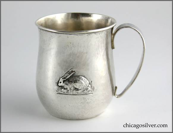 Kalo cup with  bulging bottom that tapers upward and then flares out at top, with looping strap handle, applied wire to rim, repouss rabbit on one side, engraved "C. E. D.  JR." on the other side