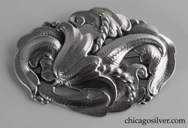 Peer Smed brooch / pin, oval, with chased and cutout design of flower blossom with large curved protruding stamens surrounded by stylized leaves.  Convex, heavy, and slightly dimensional.  Extensively hand-worked.