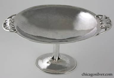 Peer Smed bowl or compote, footed, with handles.  Oval form with small flat raised edge and two handles made of curving wires each spiraling at the end and centering an applied repousse oak leaf.  