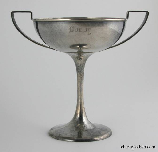 Kalo trophy cup, two-handled on pedestal base with flat top strap handles.  