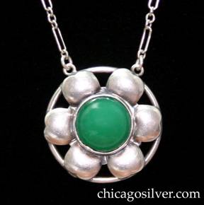 Pendant, sterling on chain with green stone.  Six-petal flower with small notch at end of each petal, on circular frame centering round bezel-set cabochon green jade or chalcedony stone, with two small loops at top that connect to long paperclip chain.  Chain has alternating long and short loops, with additional detail of three groups of three small round green stone beads near the clasp on each side, six groups of three beads total (see similar mark on pin above).  Silver expert Fred Zweig points out that a similar mark (M in a diamond) is attributed in Dorothy Rainwater's Encyclopedia of American Silver Manufacturers to Mandalian Manufacturing Company, North Attelboro, MA.