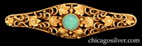 Brooch / pin, 14K gold, tapering frame with rounded ends and curving bulge in middle, centering a round bezel-set opal, with extensive detailed openwork of leaves and spiraling vines with gold beads at ends.  