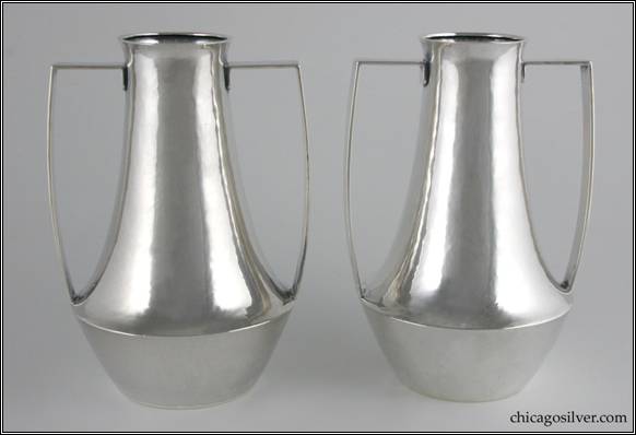 Kalo vases, pair (2), trophy form, with low wide waist tapering down to flat bottom and up to a slightly flared top.  Strap handles rise seamlessly from the waist, bulge slightly outward following the curve of the bottom part, then jut over to the body at right angles just below the top, where the handle ends turn again to lie flat against the body.  Top is slightly flared.  7-7/8" H and 5-3/4" W.  Marked:  STERLING / HAND BEATEN / AT / KALO SHOPS / PARK RIDGE ILLS.  / 8635