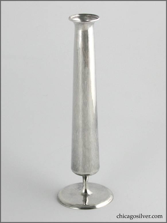 Kalo vase, bud, broad pedestal base with narrow stem supporting a tube-like vessel.  Hammered surface.  7" H and 2-1/8" at base.  Marked:  STERLING KALO / 377G